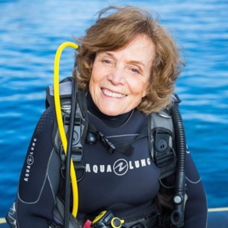 sylvia earle in a wet suit, water in the backgound